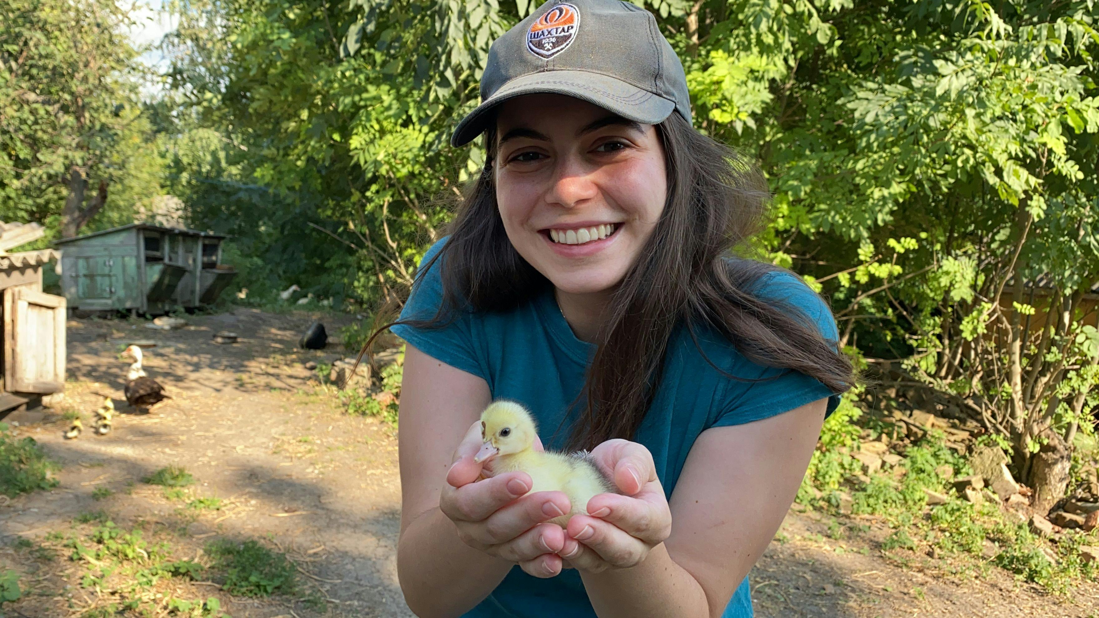 Maryna Mullerman, a first year D.V.M. student at the Cornell University College of Veterinary Medicine, holds a duckling while visiting her grandparents in the countryside outside of Kharkiv, Ukraine, in August 2021.