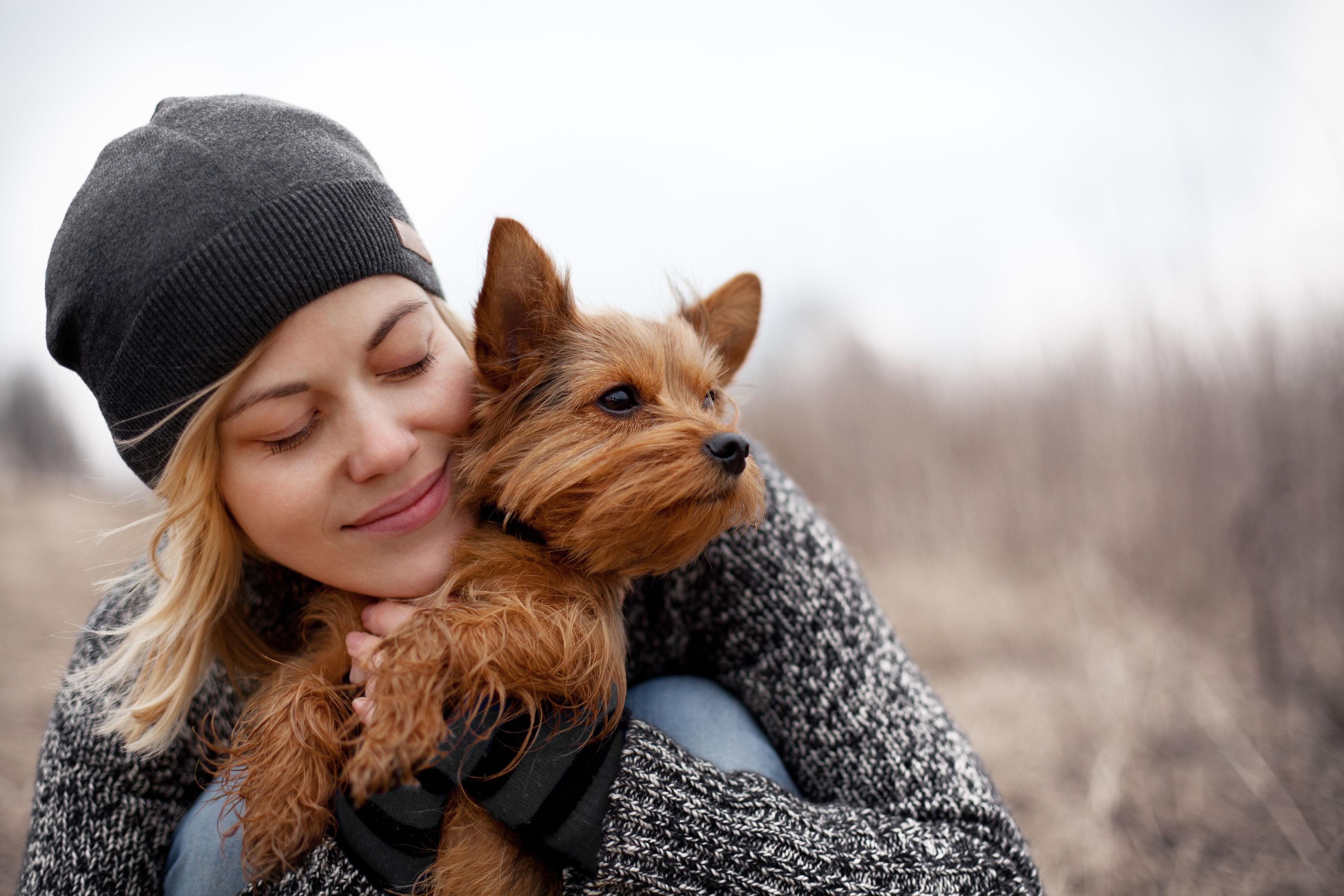 woman hugging dog