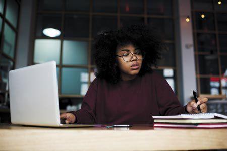 veterinary-female-student-using-laptop-450px-shutterstock-613151618.jpg