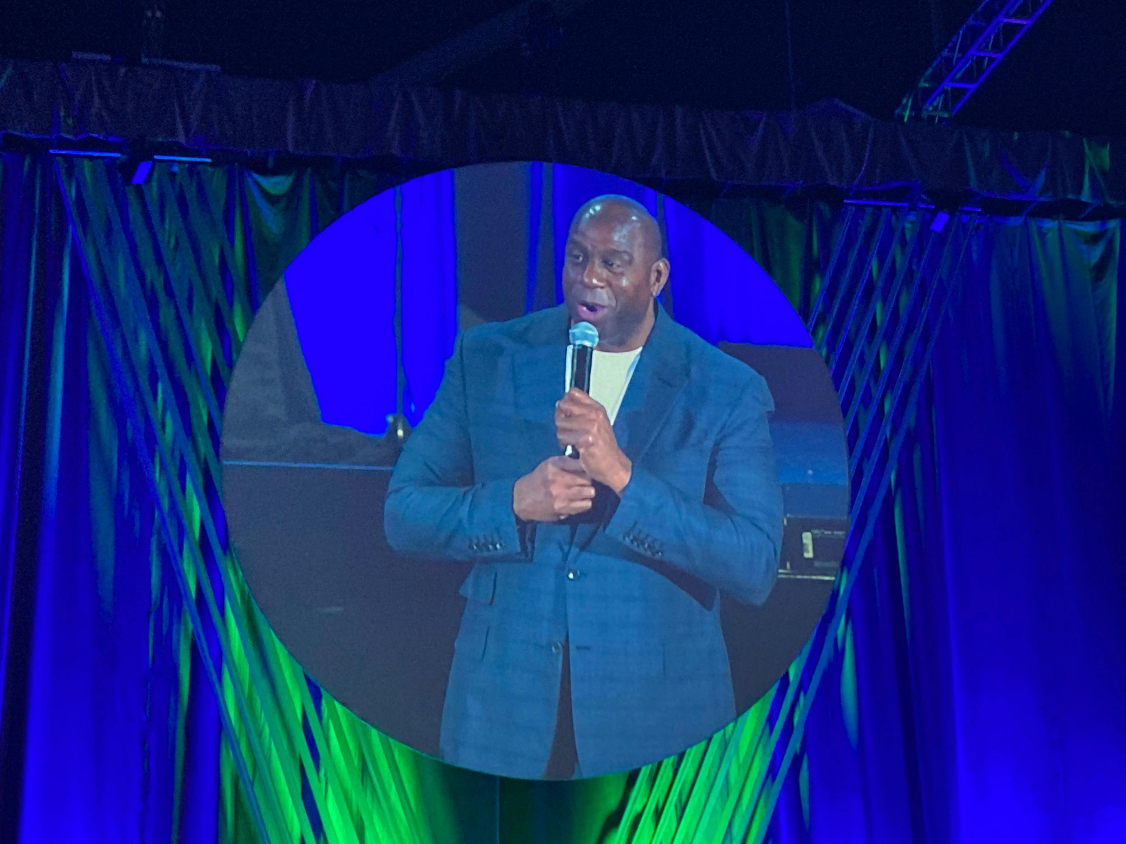 Magic Johnson addresses speaks at a veterinary conference